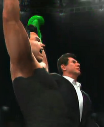 Baz McMahon helps Little Mac secure the Money in the Bank Briefcase.