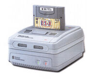 La consola Super Famicom conectada al Satellaview y con el cartucho BS-X