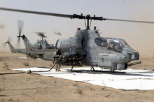 Cobra attack helicopters being refueled at a FARP during Operation Iraqi Freedom