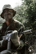 USAF Combat Control Team (CCT) member with GAU-5A/A. The GAU-5A/A can be distinguished from the GAU-5/A by the 1.5 inches of barrel between the moderator and the front sight block.