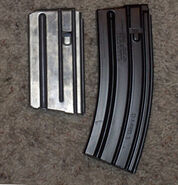 Vietnam era 20-round M16 magazine (left) and current issue NATO STANAG 30-round magazine (right).