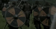 Jarl Borg's warriors carrying his shield: black and orange in a gyronny-pattern, a pattern featured on runestone depictions of shields.