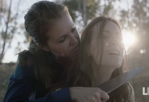 Lisa holding Jennifer at knifepoint