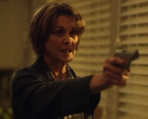 Barbara holding Kendall at gunpoint