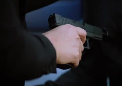 A close-up of Kristina's gun before killing The Merchant