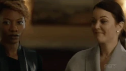 Karen locking lips with Hana, revealing their romantic relationship