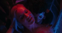 Valentina seducing and attacking a blonde woman