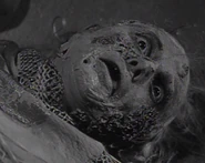 Sheila laying deceased in her monstrous form