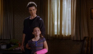 Jeremy holding his little sister hostage.