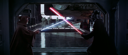 Vader dueling Obi-Wan as the hangar doors open.