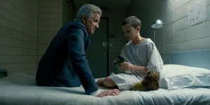 In a flashback, Brenner sits with Eleven in her room.
