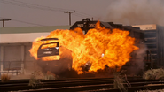 Agent 23 is killed when his SUV collides with a freight train, destroying it