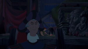 Frollo looks back at Quasimodo as he leaves.