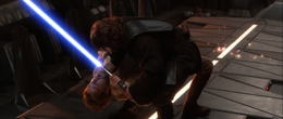 Vader simultaneously throttling him and forcing Kenobi's saber closer to his face.