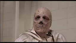 Dr. Phibes' gruesomely disfigured face.