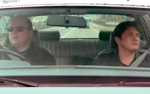 Phil takes Ricky out for a drive in Walford (2000).