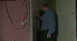 Phil wants Dan to tell him where Mel is hiding (2001).