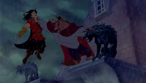 Gaston getting his life at stake as the Beast threatens to drop him into the castle moat.