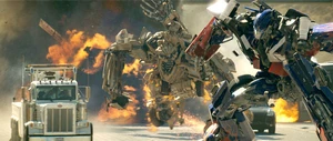 Bonecrusher fighting Optimus Prime.