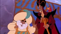 Jafar chuckling with the Sultan before he leaves.
