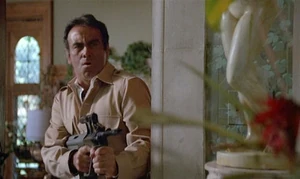 Arius firing his AUG at Matrix.