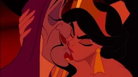 Jasmine kissing Jafar to distract him.