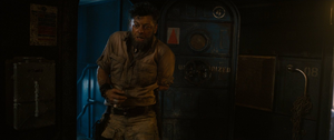 Klaue's arm is sliced off by Ultron in anger.