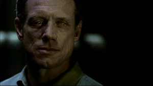 Azazel grinning to John.