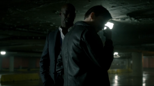 Malcolm being threatened by Amenadiel.