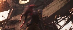 Thanos hurls Spider-Man.