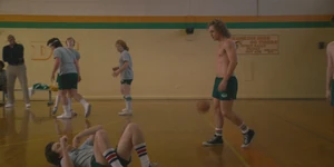 Billy having won the basketball match as he approaches Steve.