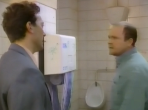 Phil Mitchell clashing with local market inspector Richard Cole.