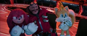 Tails, Knuckles, and Dr. Eggman looking on in horror after accidentally slicing off a chunk of the moon