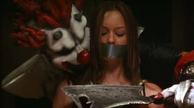 Horny laughing next to a terrified Mackenzie.