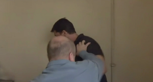 Phil gets the upper hand over Dan in their fight (2001).
