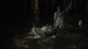 Malik and Nick as they kill the Hammerhead Shark.