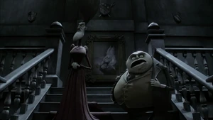 Maudeline and Finis walking down the stairs.