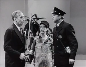 Grover misguiding a cop and janitor