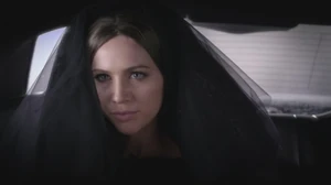 Sara's black veil disguise.