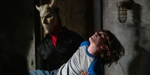 Black-phone-88.jpg (34 KB) The Grabber carrying Finney in the basement.