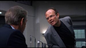 Clarence reacts angrily when Jones rebukes him for telling RoboCop about their secret collusion.