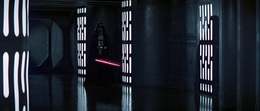 Vader awaiting Obi-Wan with his lightsaber drawn.