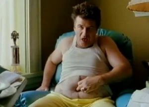 Larry picking his belly button after finally persuading Joan to his idea of military school.