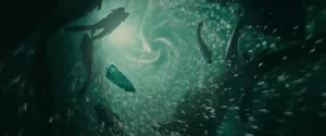 The piranhas leaving the cave and swimming towards Matt Boyd's boat.