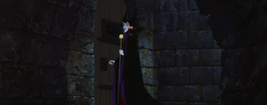 Maleficent and Diablo about to exit out of Phillip's cell.