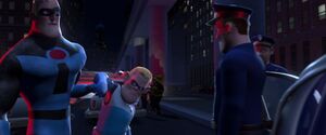 Mr. Incredibles orders the police to take Buddy home.