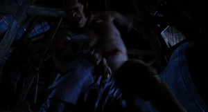 Mr. Hyde angrily lunging forward, grabbing Van Helsing and throws him clear up through the roof.