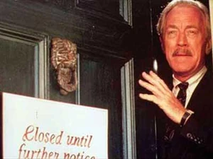 Gaunt at the door of his shop.