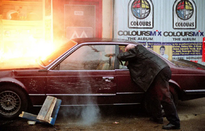 Phil manages to save Louise from Steve shortly before the latter's death in a vehicle explosion following their high-speed car chase (2002).