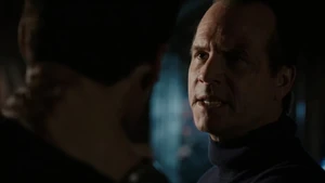 Garrett beating up Ward for his undercover assignment.